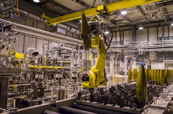 A robot moves an inert projectile from a conveyor tray to a device that will remove the nose closure at the Blue Grass Chemical Agent-Destruction Pilot Plant. As the U.S. Army Corps of Engineers’ agent for facility design and construction of all chemical demilitarization facilities, Huntsville Center has a long history building the facilities used to destroy chemical weapons, including BGCAPP.