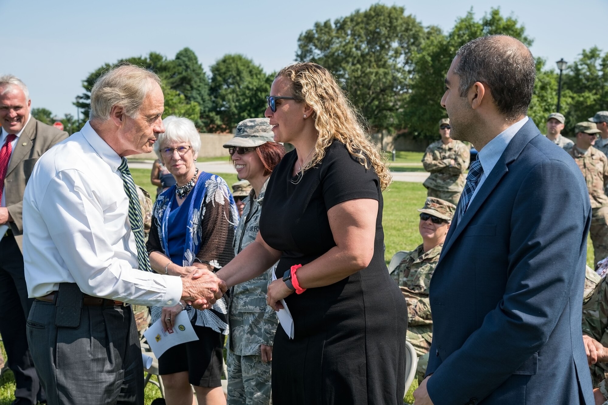 Sen. Tom Carper, D-Del., shakes hands with Jessica Marelli, Caesar Rodney School District Board of Education president, Camden, Del.; prior to the start of a groundbreaking ceremony for the new Welch Elementary School/Dover Air Base Middle School June 3, 2019, in the family housing area at Dover Air Force Base, Del. The $48 million project, federally funded by the Department of Defense Education Activity, will be built on the football field across the street from the Youth Center and adjacent to the existing elementary and middle schools. Scheduled to open at the beginning of the 2021 school year, the new building will have over 105,000 square feet of learning space for approximately 490 students. (U.S. Air Force photo by Roland Balik)