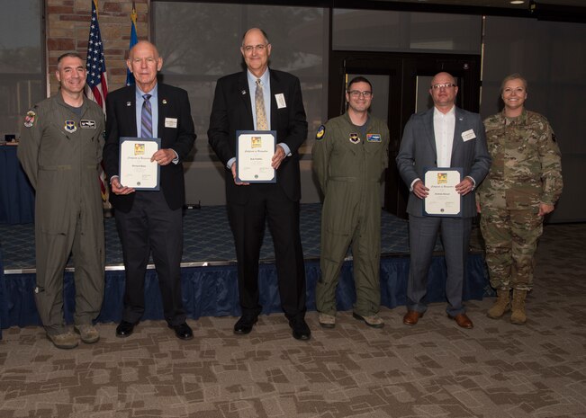 Col. Joseph Campo, 49th Wing commander (left) and Chief Master Sgt. Sarah Esparza, 49th Wing command chief (right), pose with the 49th Wing Staff Agencies honorary commanders and Maj. Thomas Wittwer, Command Post director (fourth from the left), pose for a photo, May 31, 2019, on Holloman Air Force Base, N.M. The honorary commander program establishes and maintains personal relationships with local civic leaders, and aids in increasing public awareness of the missions, policies and programs of the Department of Defense and United States Air Force. (U.S. Air Force photo by Staff Sgt. BreeAnn Sachs)