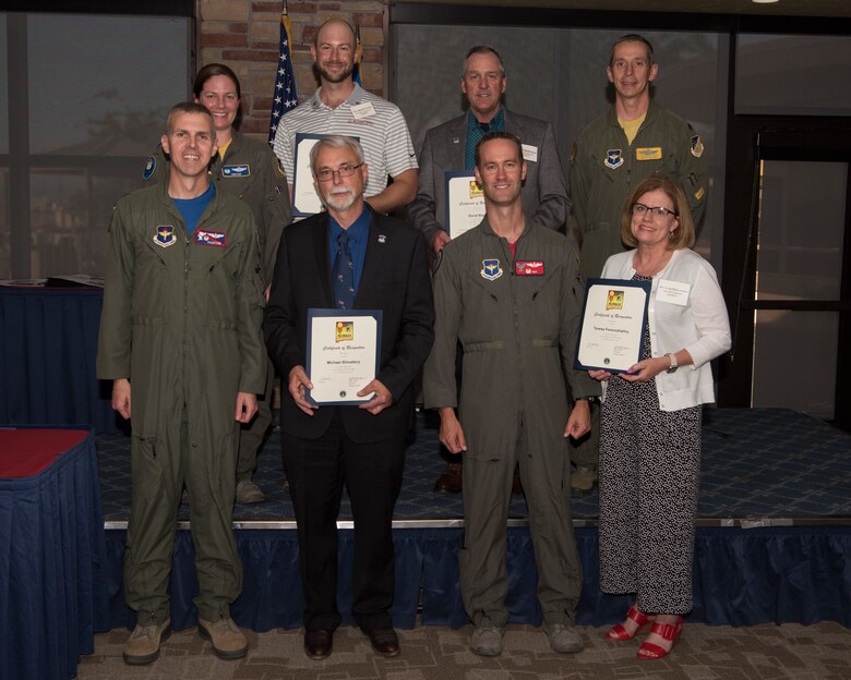 Commanders and honorary commanders from the 49th Operations Group pose for a photo, May 31, 2019, on Holloman Air Force Base, N.M. The honorary commander program establishes and maintains personal relationships with local civic leaders, and aids in increasing public awareness of the missions, policies and programs of the Department of Defense and United States Air Force. (U.S. Air Force photo by Staff Sgt. BreeAnn Sachs)