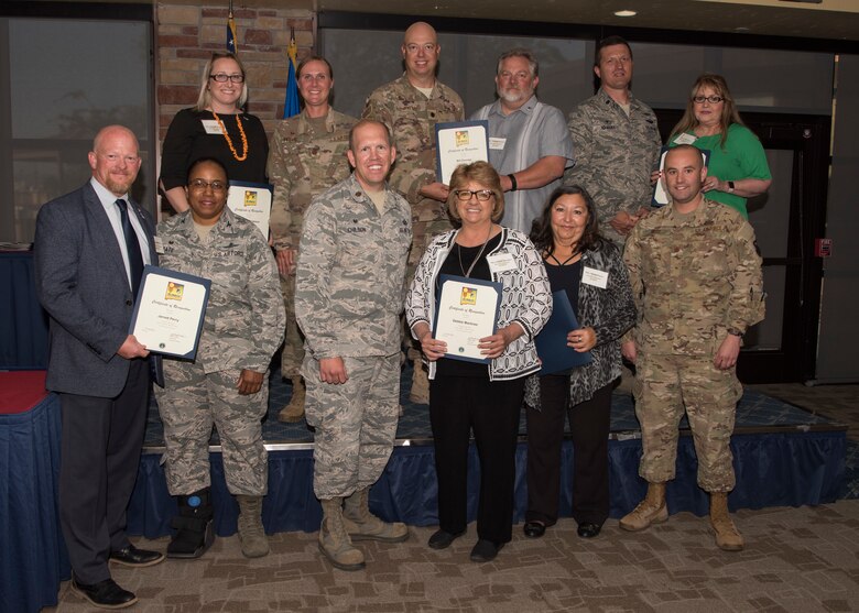Commanders and honorary commanders from the 49th Mission Support Group pose for a photo, May 31, 2019, on Holloman Air Force Base, N.M. The honorary commander program establishes and maintains personal relationships with local civic leaders, and aids in increasing public awareness of the missions, policies and programs of the Department of Defense and United States Air Force. (U.S. Air Force photo by Staff Sgt. BreeAnn Sachs)