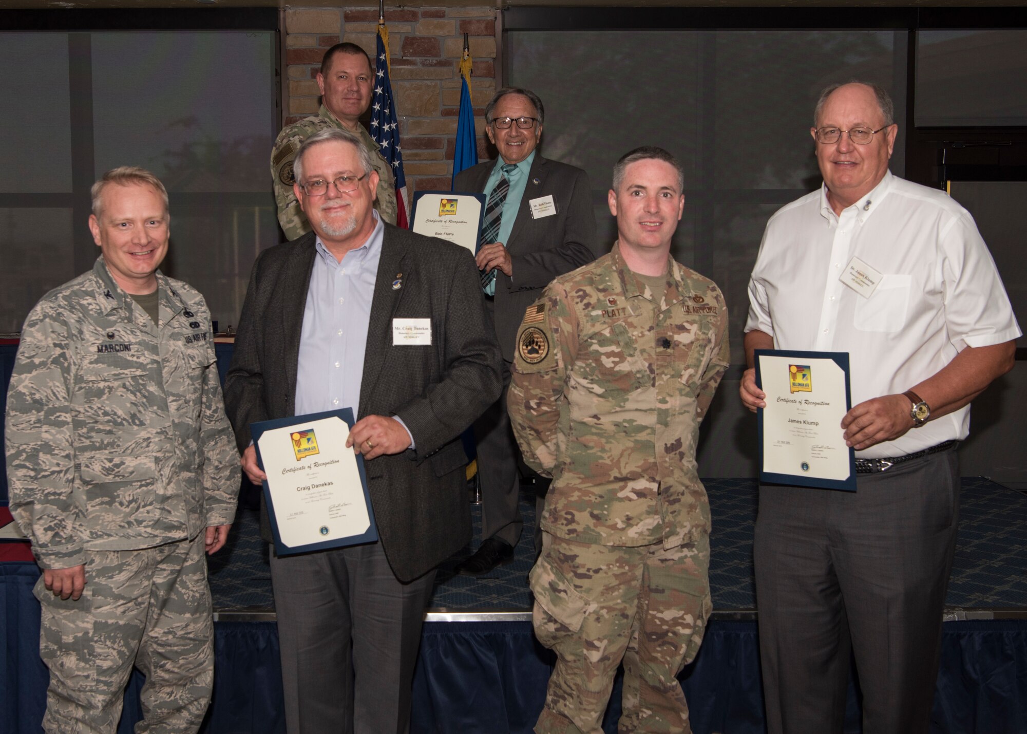 Commanders and honorary commanders from the 635th Materiel Maintenance Group pose for a photo, May 31, 2019, on Holloman Air Force Base, N.M. The honorary commander program establishes and maintains personal relationships with local civic leaders, and aids in increasing public awareness of the missions, policies and programs of the Department of Defense and United States Air Force. (U.S. Air Force photo by Staff Sgt. BreeAnn Sachs)