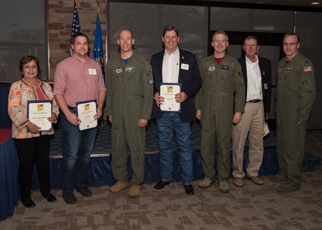 Commanders and honorary commanders from the 704th Test Group, assigned tenant units and detachments pose for a photo, May 31, 2019, on Holloman Air Force Base, N.M. The honorary commander program establishes and maintains personal relationships with local civic leaders, and aids in increasing public awareness of the missions, policies and programs of the Department of Defense and United States Air Force. (U.S. Air Force photo by Staff Sgt. BreeAnn Sachs)