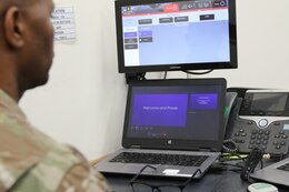 The 184th Sustainment Command's unit ministry team brings religious services to warfighters near and far using video teleconference technology during a service at Camp Arifjan, Kuwait, May 26, 2019.