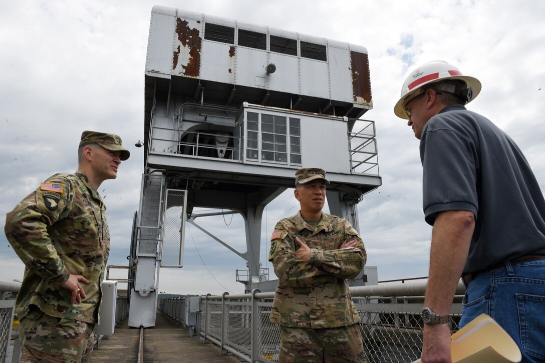 John Tribble (Right), U.S. Army Corps of Engineers Nashville District mechanical engineer, and Lt. Col. Cullen Jones (Left), Nashville District commander, address status of crane repairs at Barkley Dam with Maj. Gen. Mark Toy, Great Lakes and Ohio River Division commander, during a visit to the project on the Cumberland River in Grand Rivers, Ky., June 4, 2019. (USACE photo by Lee Roberts)