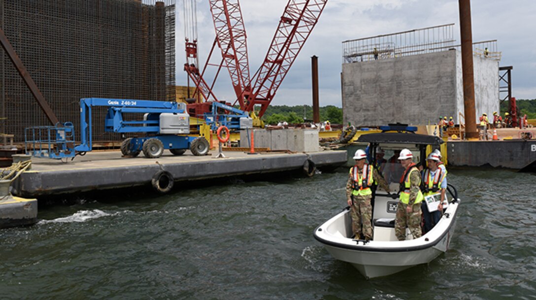 Maj. Gen. Mark Toy, U.S. Army Corps of Engineers Great Lakes and Ohio River Division commander, observes operations to construct concrete shells being assembled on the shoreline of the Tennessee River during a ride in a Corps of Engineers patrol boat at the Kentucky Lock Addition Project in Grand Rivers June 4, 2019.  The shells are being installed to the downstream riverbed for dual use as part of the permanent lock wall and for the coffer dam. (USACE photo by Lee Roberts)