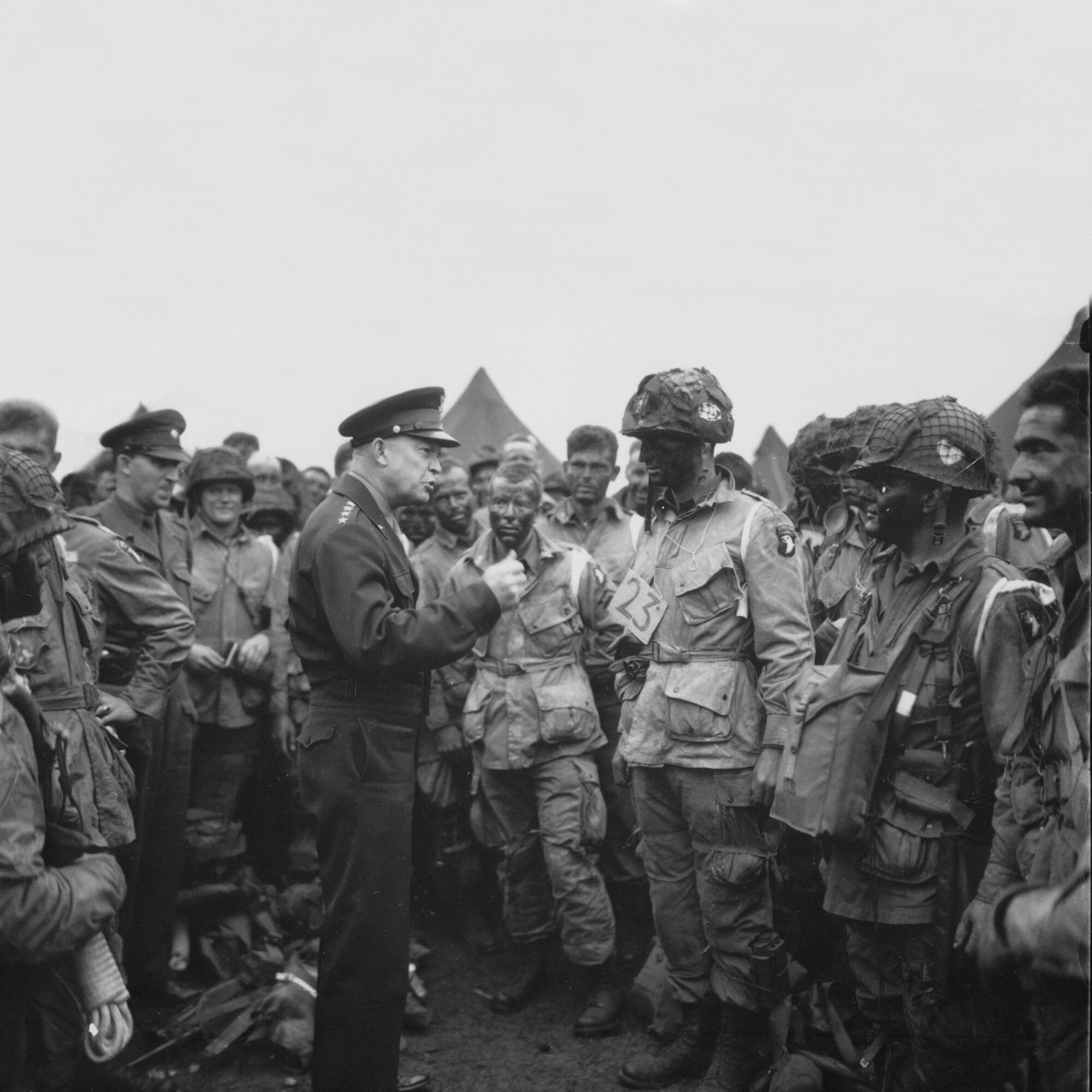 General Dwight D. Eisenhower, the Supreme Allied Commander in charge of all forces involved in the Normandy landing, speaks to paratroopers of the 101st Airborne Division on the eve of D-day, 5 June 1944.