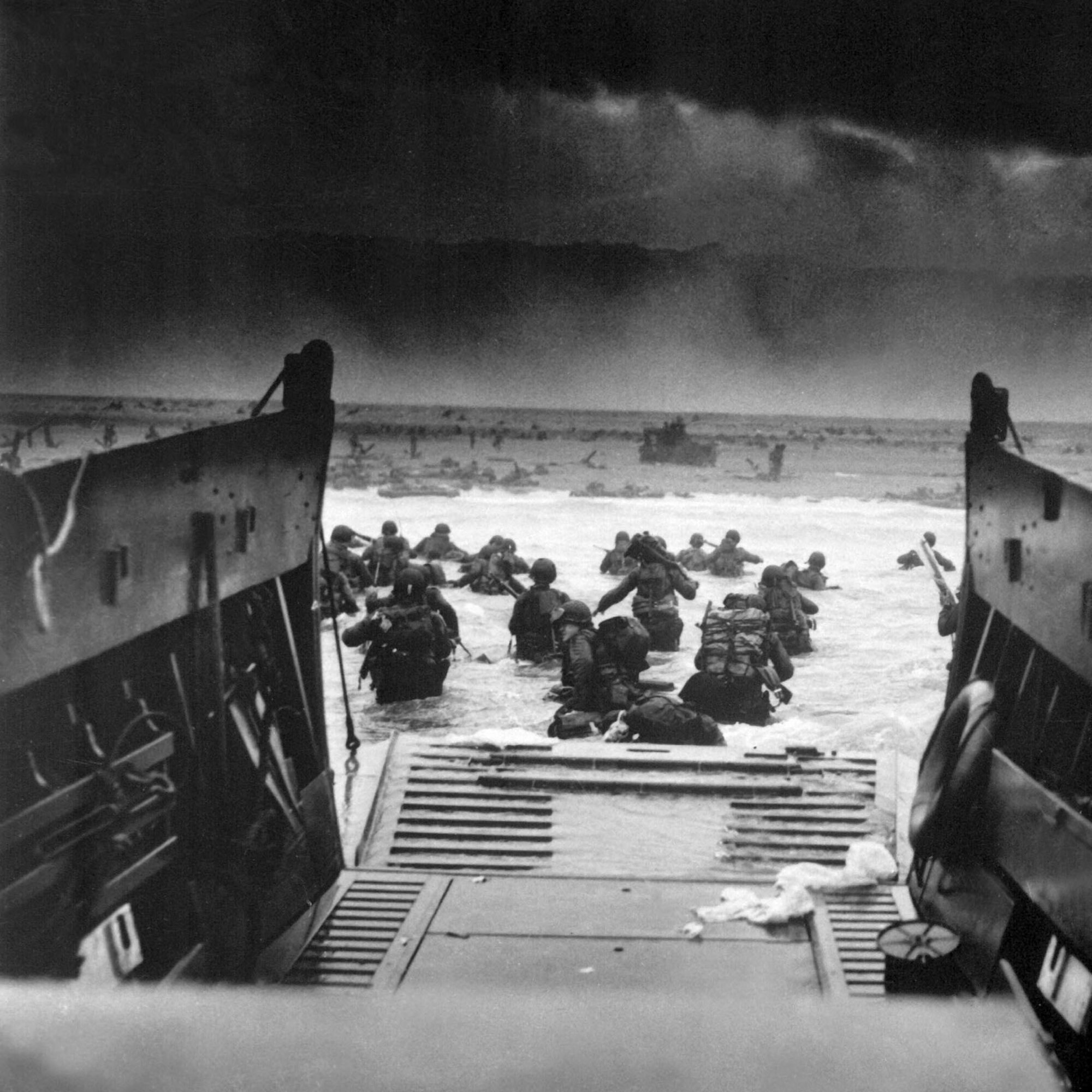Landing on the coast of France under heavy Nazi machine gun fire are these American soldiers, shown just as they left the ramp of a Coast Guard landing boat, June 6, 1944.  CPhoM. Robert F. Sargent. (Coast Guard)
NARA FILE #:  026-G-2343
WAR & CONFLICT BOOK #: 1041