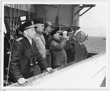 Senior U.S. officers watch operations from the bridge of USS Augusta (CA 31) off Normandy, June 8, 1944. They are from left to right: Commander Western Naval Task Force Rear Adm. Alan G. Kirk; Commanding General, U.S. First Army Lt. Gen. Omar N. Bradley; Chief of Staff Rear Adm. Arthur D. Struble; and Army Maj. Gen. Ralph Royce.