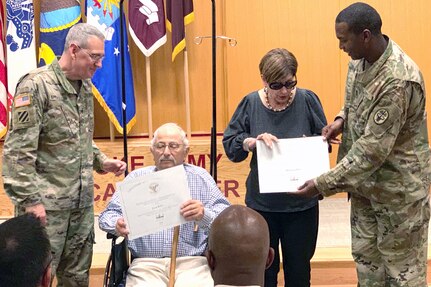 Brig. Gen. George Appenzeller, BAMC commanding general, and Command Sgt. Maj. James Brown present Jack and Martha Rips with the President’s Lifetime Achievement Award May 30 for their service hours as Fisher House volunteers near Brooke Army Medical Center. They each have given in excess of 4,060 hours.