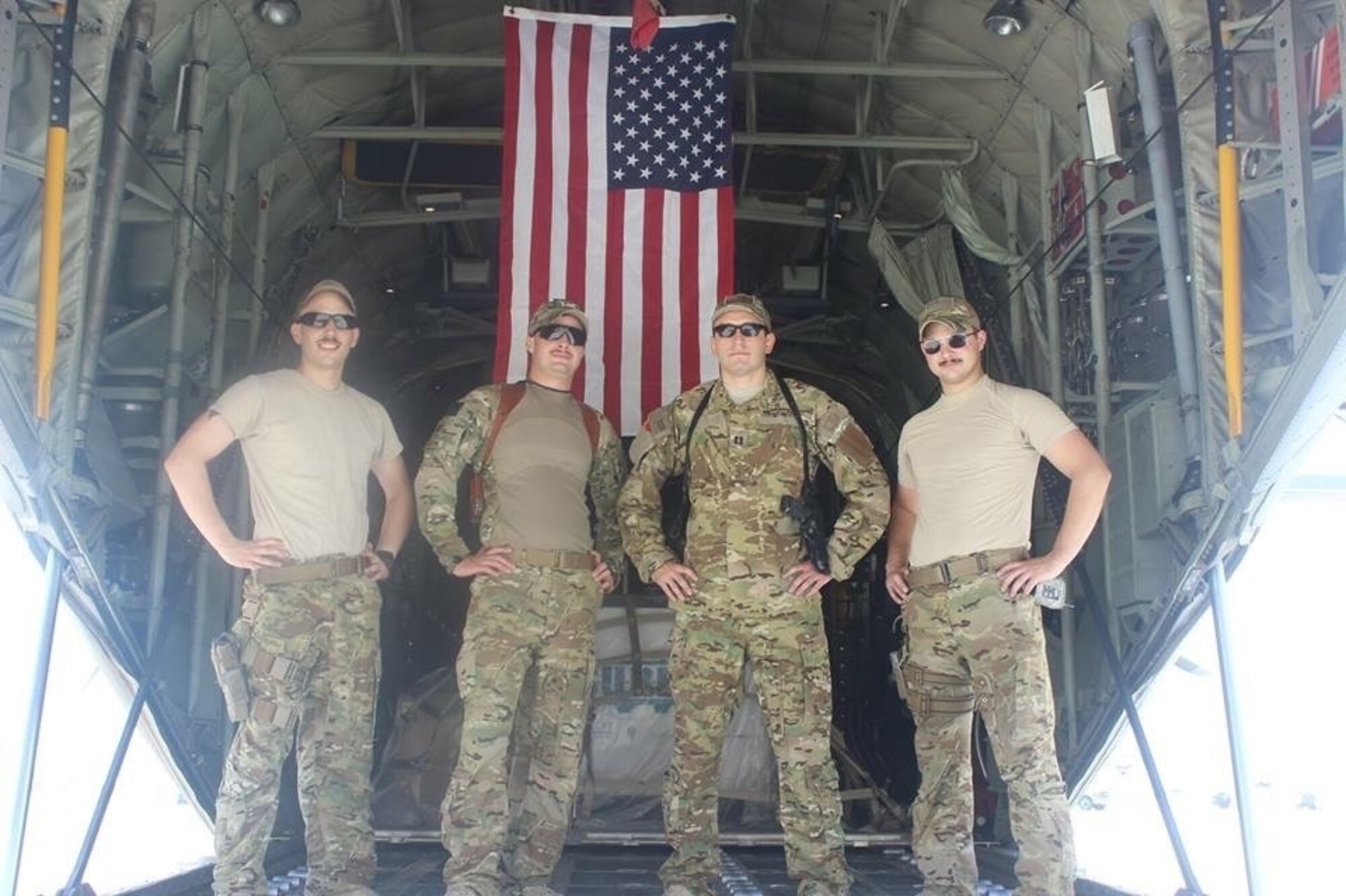 Maj. Justin Pedone, then Capt. Pedone, stands in the back of a C-30 Hercules with the pilots he flew alongside in Afghanistan. Pedone has flown tactical airlift operations from humanitarian efforts to the war on terror in both the C-130H and C-130J Hercules models similarly to his relative retired Col. Vito Pedone, who flew the C-47 Skytrain into battle on D-Day. (Courtesy photo)