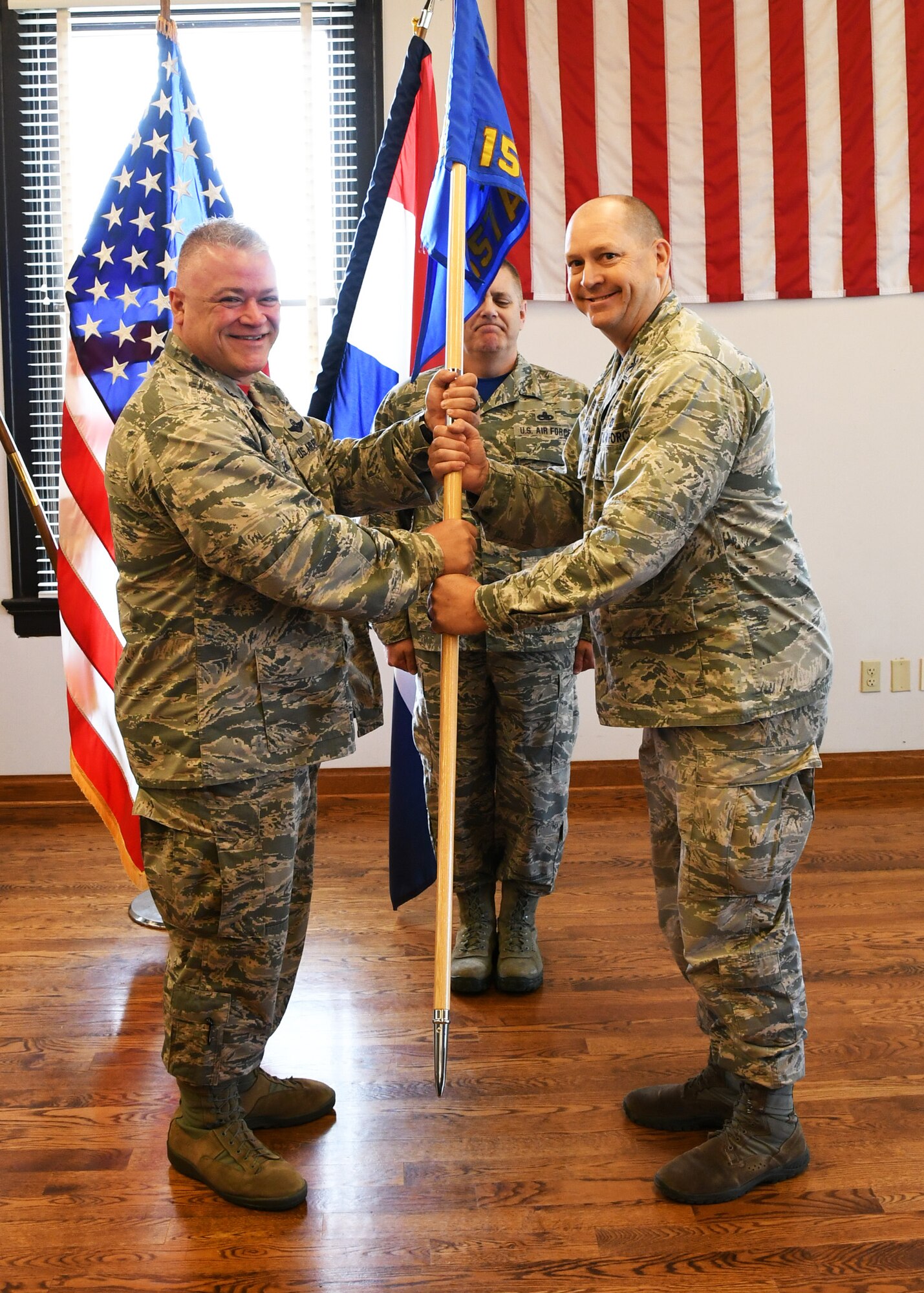 Col. William Boothman takes guidon from Col. Ken Eaves at the 157th Air Operations Group change of command ceremony at Jefferson Barracks Air National Guard Base.