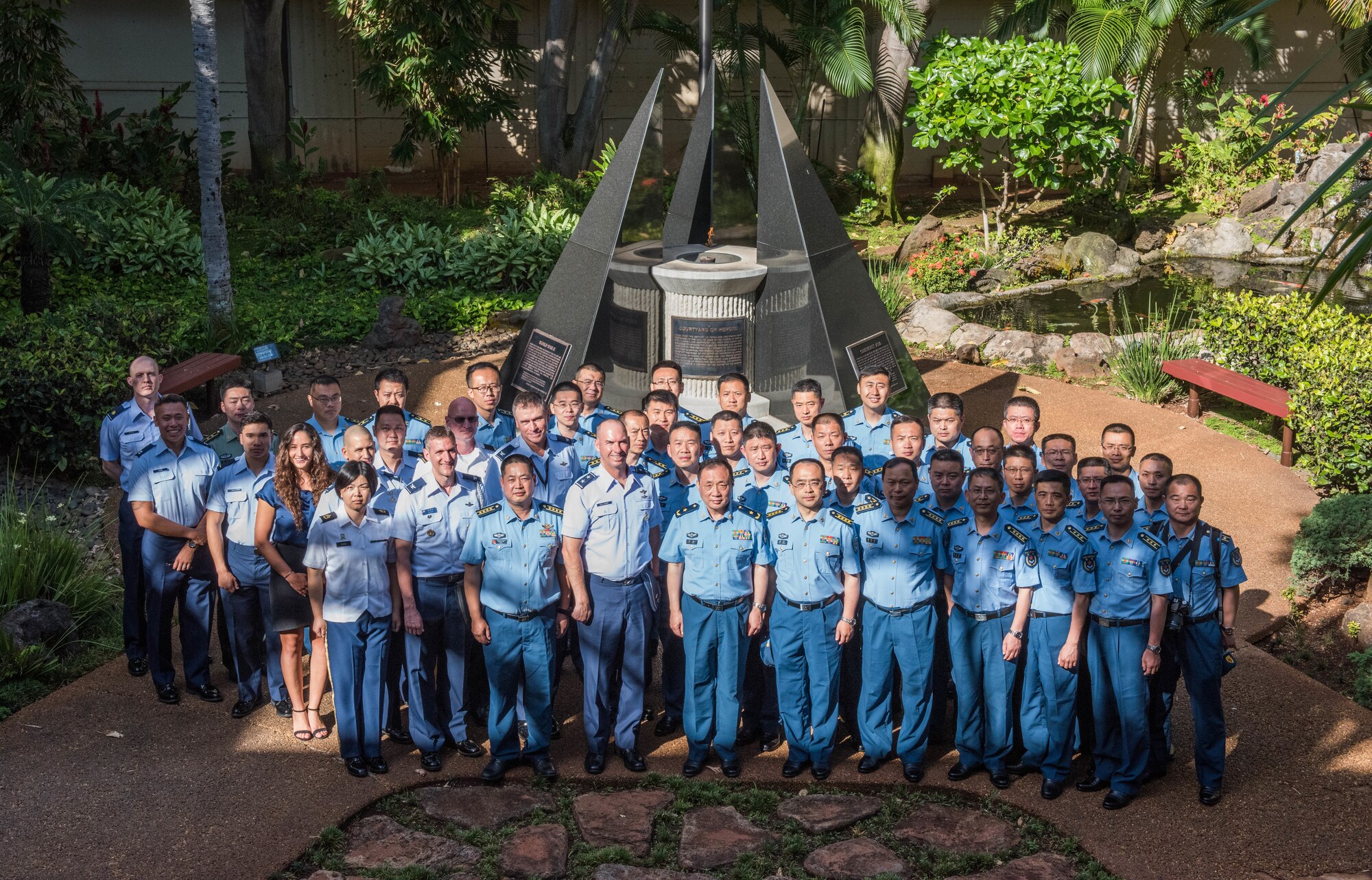 United States Air Force Airmen take a group photo with members of the People’s Liberation Army Air Force Command College during a visit to Headquarters Pacific Air Forces at Joint Base Pearl Harbor-Hickam, Hawaii, May 28, 2019.