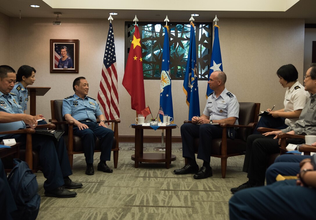 People’s Liberation Army Air Force Maj. Gen. An Peng, Command College deputy commandant, and U.S. Air Force Maj. Gen. Brian Killough, Pacific Air Forces deputy commander, have a discussion during an office call at Headquarters Pacific Air Forces at Joint Base Pearl Harbor-Hickam, Hawaii, May 28, 2019.