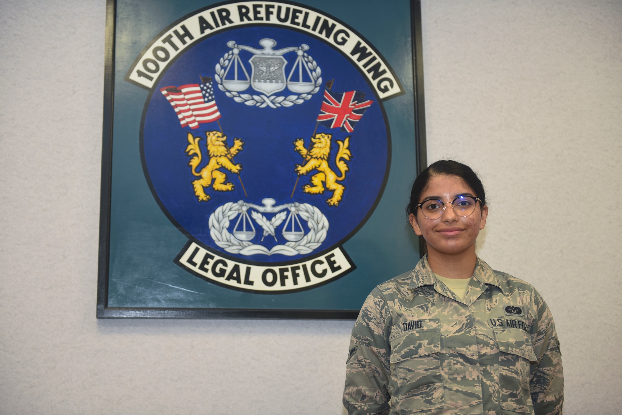 U.S. Air Force Airman Gisselle David, 100th Air Refueling Wing judge advocate military justice paralegal, poses for a photo at the base legal office on RAF Mildenhall, England, May 28, 2019. The legal office provides services like notaries, power of attorneys, wills and legal assistance to Team Mildenhall Airmen and their families. (U.S. Air Force photo by Airman 1st Class Joseph Barron)