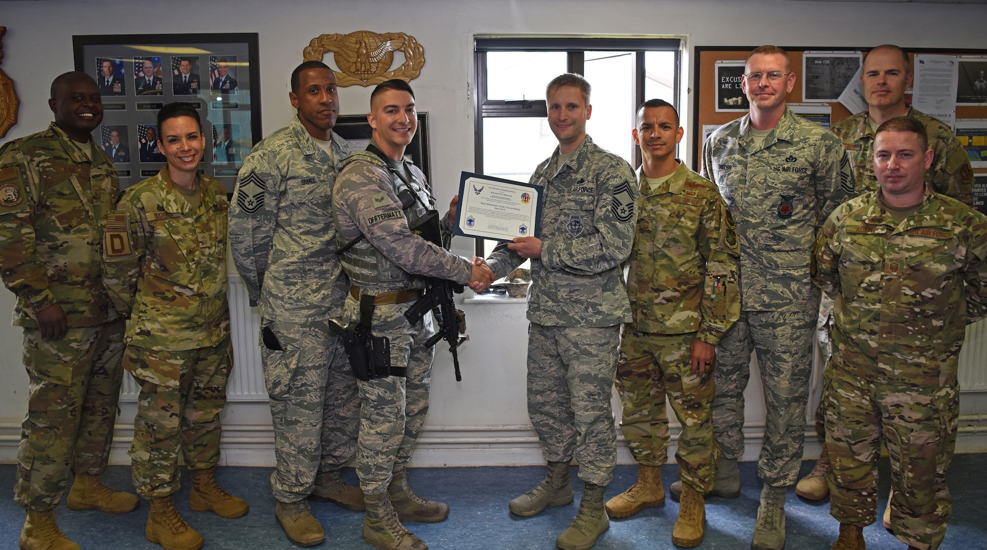 U.S. Air Force Senior Airman Justin Offtermatt, 100th Security Forces Squadron member, was presented with the Chiefs’ Choice Award at RAF Mildenhall, England, May 20, 2019. Offtermatt, along with his wife, Alicia, were recognized for their heroic efforts to help a mother and her children after a car accident while vacationing in Europe. (U.S. Air Force photo by Airman 1st Class Brandon Esau)