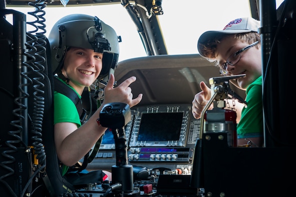 Children tour the inside of a UH-60 Blackhawk helicopter during the 2nd Annual Deployment Discovery Day, May 11, 2019 at Bradley Air National Guard Base, Conn. Deployment Discovery Day is an joint event hosted by the Connecticut Army and Air National Guard that aims to help the children of service members understand the military deployment deployment process. (U.S. Air National Guard photo by Tech. Sgt. Tamara R. Dabney)