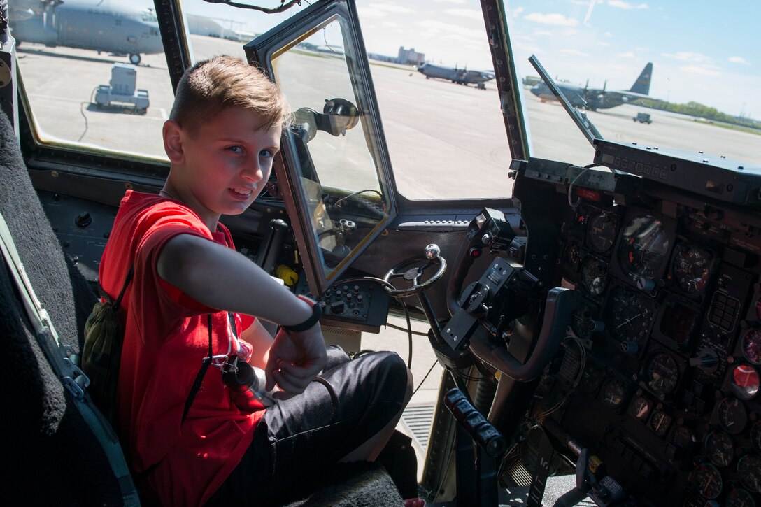 A child tours the inside of a C-130 H Hercules aircraft during the 2nd Annual Deployment Discovery Day, May 11, 2019 at Bradley Air National Guard Base, Conn. Deployment Discovery Day is an joint event hosted by the Connecticut Army and Air National Guard that aims to help the children of service members understand the military deployment deployment process. (U.S. Air National Guard photo by Tech. Sgt. Tamara R. Dabney)