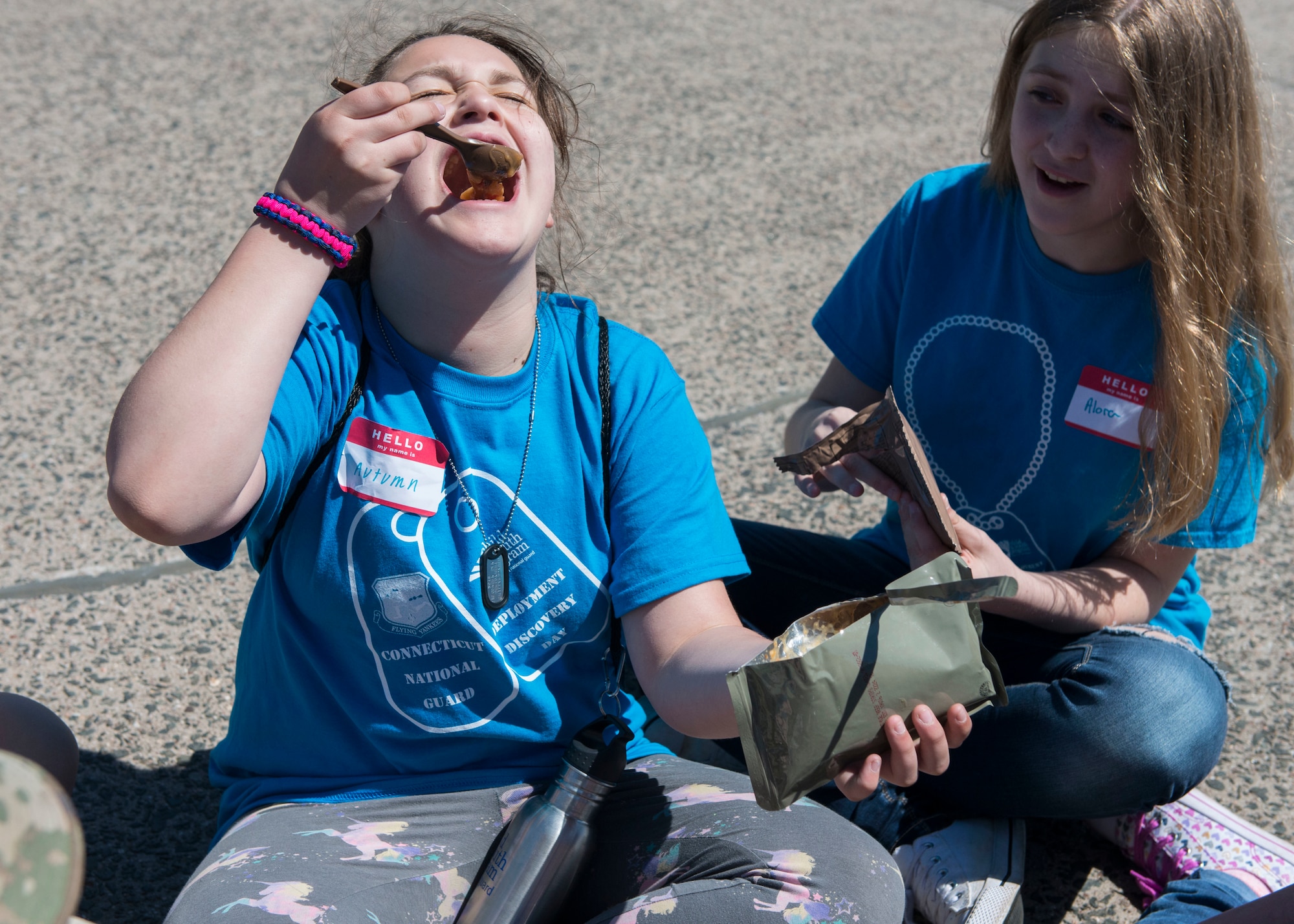 A child consumes a Meal-Ready-to-Eat (MRE) during the 2nd Annual Deployment Discovery Day, May 11, 2019 at Bradley Air National Guard Base, Conn. Deployment Discovery Day is an joint event hosted by the Connecticut Army and Air National Guard that aims to help the children of service members understand the military deployment deployment process. (U.S. Air National Guard photo by Tech. Sgt. Tamara R. Dabney)
