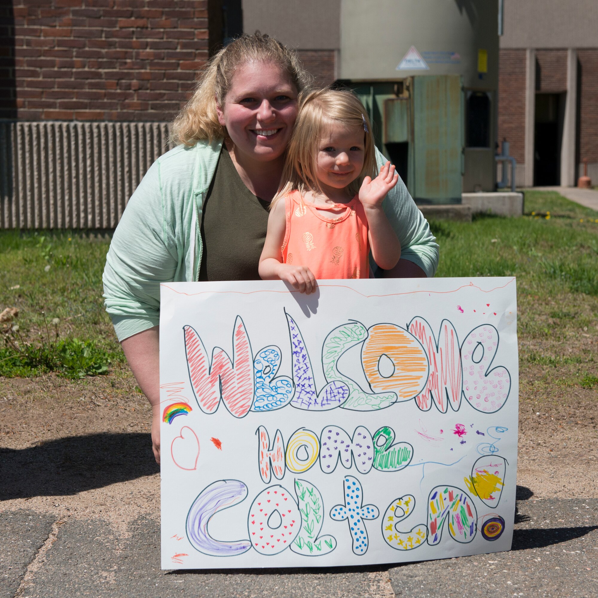 A parent and child await the return of a child who participated in a mock deployment during the 2nd Annual Deployment Discovery Day, May 11, 2019 at Bradley Air National Guard Base, Conn. Deployment Discovery Day is an joint event hosted by the Connecticut Army and Air National Guard that aims to help the children of service members understand the military deployment deployment process. (U.S. Air National Guard photo by Tech. Sgt. Tamara R. Dabney)