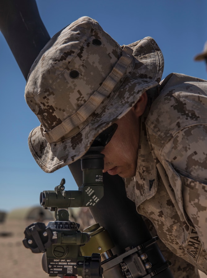 U.S. Marine Lance Cpl. Robert Morgan, a mortarman with Weapons Company, 3rd Battalion, 25th Marine Regiment, 4th Marine Division looks through the viewfinder of an 81mm mortar system during Integrated Training Exercise 4-19 at Marine Corps Air Ground Combat Center Twentynine Palms, Calif., June 5, 2019. ITX measures the ability to provide a cohesive, trained and ready capability in support of service and Combatant Commander requirements. (U.S. Marine Corps photo by Cpl. Tessa D. Watts)