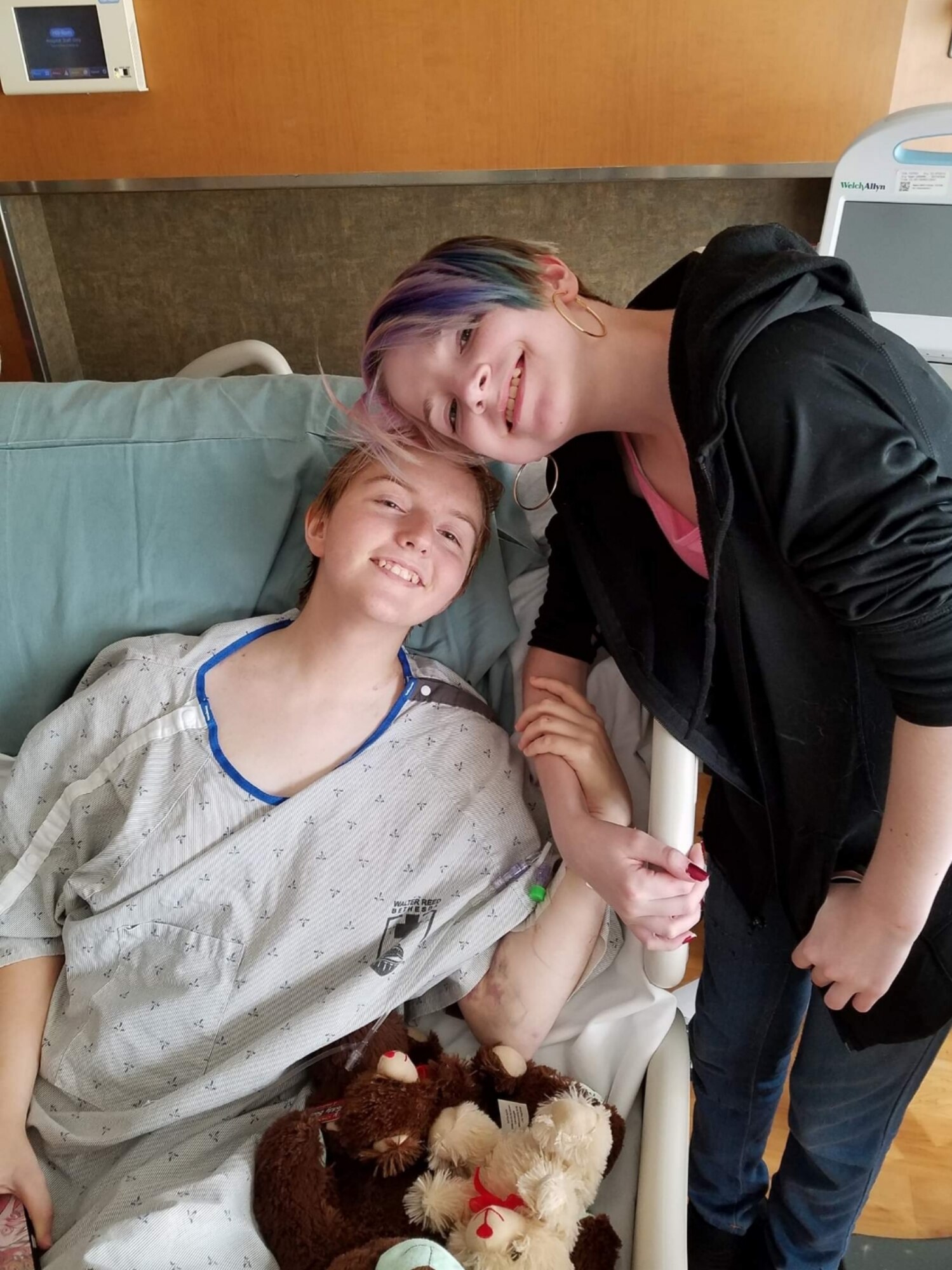 U.S. Air Force Airman 1st Class Constance Bratcher takes a photo with her cousin while in the hospital around May 2018.