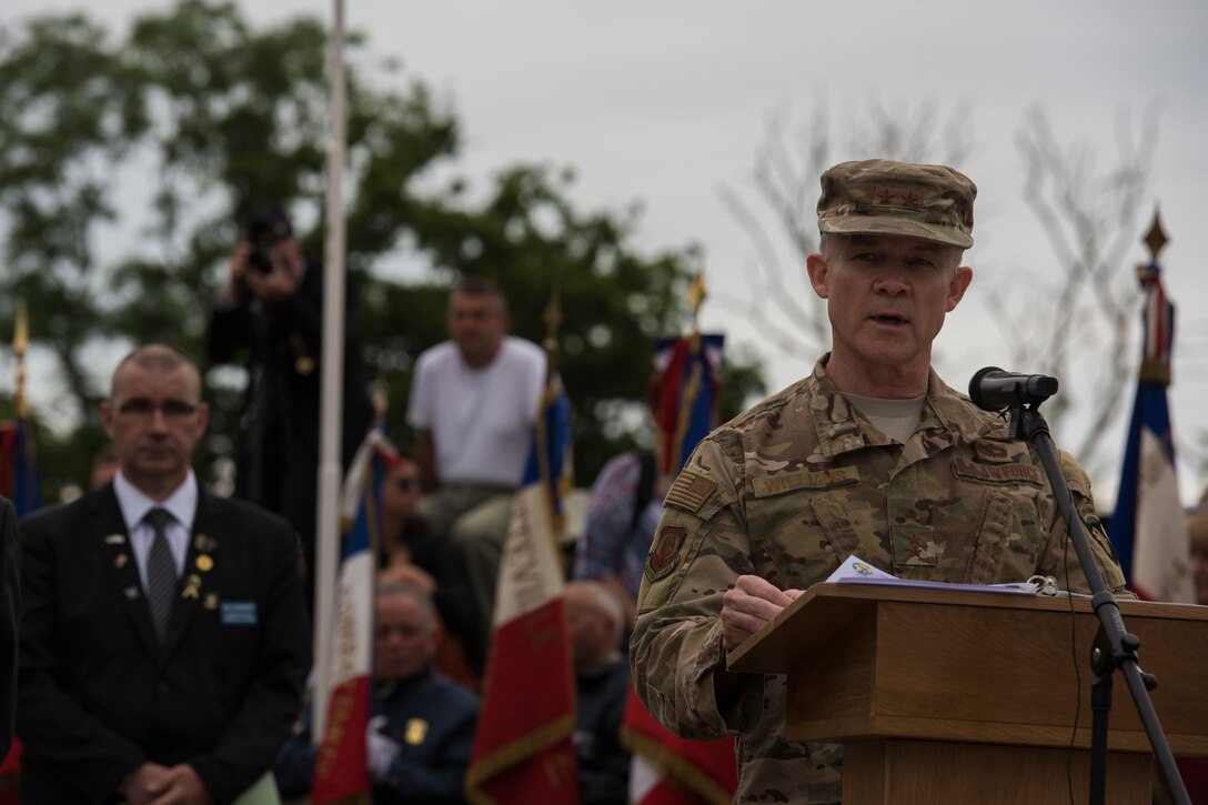 U.S. Air Force Maj. Gen. John B. Williams, United States Air Forces in Europe and Air Forces Africa mobilization assistant to the commander, speaks at a ceremony held in honor of all airborne troops and flight crew that served on D-Day in Picauville, France, June 4, 2019. Williams said seeing the terrain where so many U.S. sacrifices were made is a poignant reminder of the cost of freedom experienced today. (U.S. Air Force photo by Senior Airman Kristof J. Rixmann)