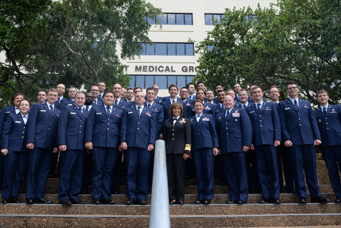 Graduate Medical Education program graduates pose for a group photo outside the 81st Medical Group at Keesler Air Force Base, Mississippi, May 23, 2019.