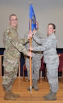 Lt. Col. James A. Hearn III, 433rd Mission Support Group deputy commander, presents the guidon to Maj. Jaime L. “Leigh” Barker, 433rd Civil Engineer Squadron commander, signifying the assumption of squadron command June 1 at Joint Base San Antonio-Lackland. Barker is returning to the 433rd CES after working as the 433rd Airlift Wing executive officer.