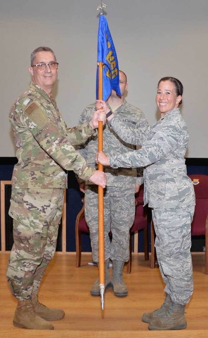 Lt. Col. James A. Hearn III, 433rd Mission Support Group deputy commander, presents the guidon to Maj. Jaime L. “Leigh” Barker, 433rd Civil Engineer Squadron commander, signifying the assumption of squadron command June 1 at Joint Base San Antonio-Lackland. Barker is returning to the 433rd CES after working as the 433rd Airlift Wing executive officer.