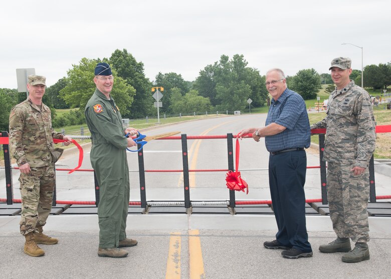 (Left to Right) The Vice Commander of the 509th Bomb Wing, Col. Seth Graham, the Commander of the 442nd Fighter Wing, Brig. Gen. Roger Suro, the Deputy Commander of the 509th Mission Support Group, Mr. Kendall Nugent, and the Deputy Commander of the 509th Mission Support Group, Lt. Col. Anthony DeGregoria cut the ribbon to reopen Arnold Gate on June 4, 2019, at Whiteman Air Force Base, Missouri, with a new barrier. Arnold Gate was shut down, intermittently, due to the construction of a new gate barrier system. (U.S. Air National Guard photo by Senior Airman Bailey Janes)