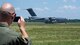 Maj. John R. Blankenship, a B-52 Stratofortress pilot with the 96th Bomb Squadron, records his wife Maj. Natasha E. Blankenship, a C-17 Globemaster III pilot with the 183rd Airlift Squadron in Jackson, Mississippi, as she lands a C-17 as apart of the Barksdale Defenders of Liberty Air Show at Barksdale Air Force Base, La., May 16, 2019. The Blankenships met each other during pilots training and have been married for the past eight years. (U.S. Air Force photo by Airman Jacob B. Wrightsman)