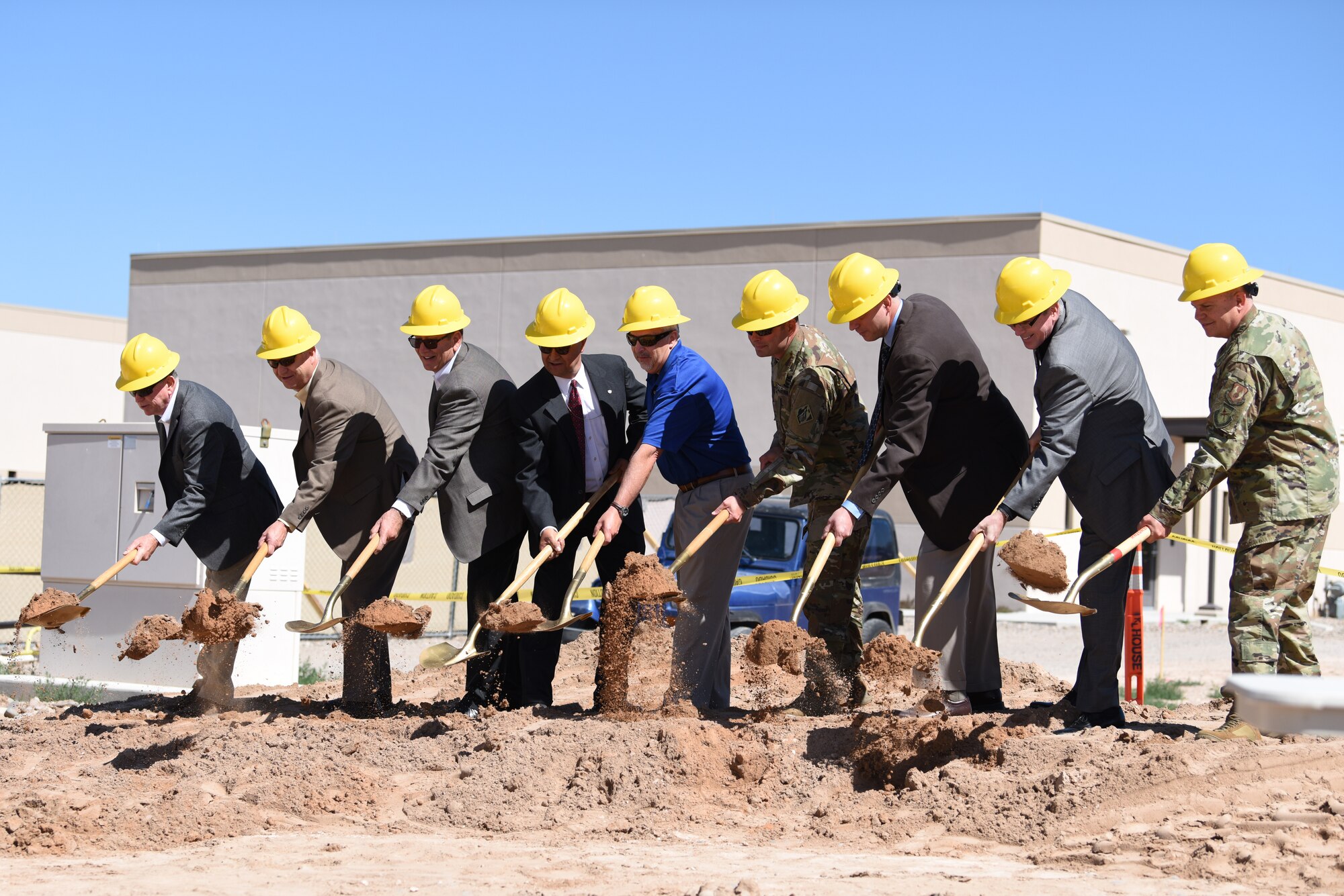 Members of the construction crew and Air Force Research Laboratory officially break ground on the Space Control Laboratory during a groundbreaking ceremony at Kirtland Air Force Base, N.M., June 6, 2019. The new laboratory is scheduled to be completed in July of 2020, and will have 26,000 square feet of laboratory, office and administrative space. (U.S. Air Force photo by Senior Airman Eli Chevalier)