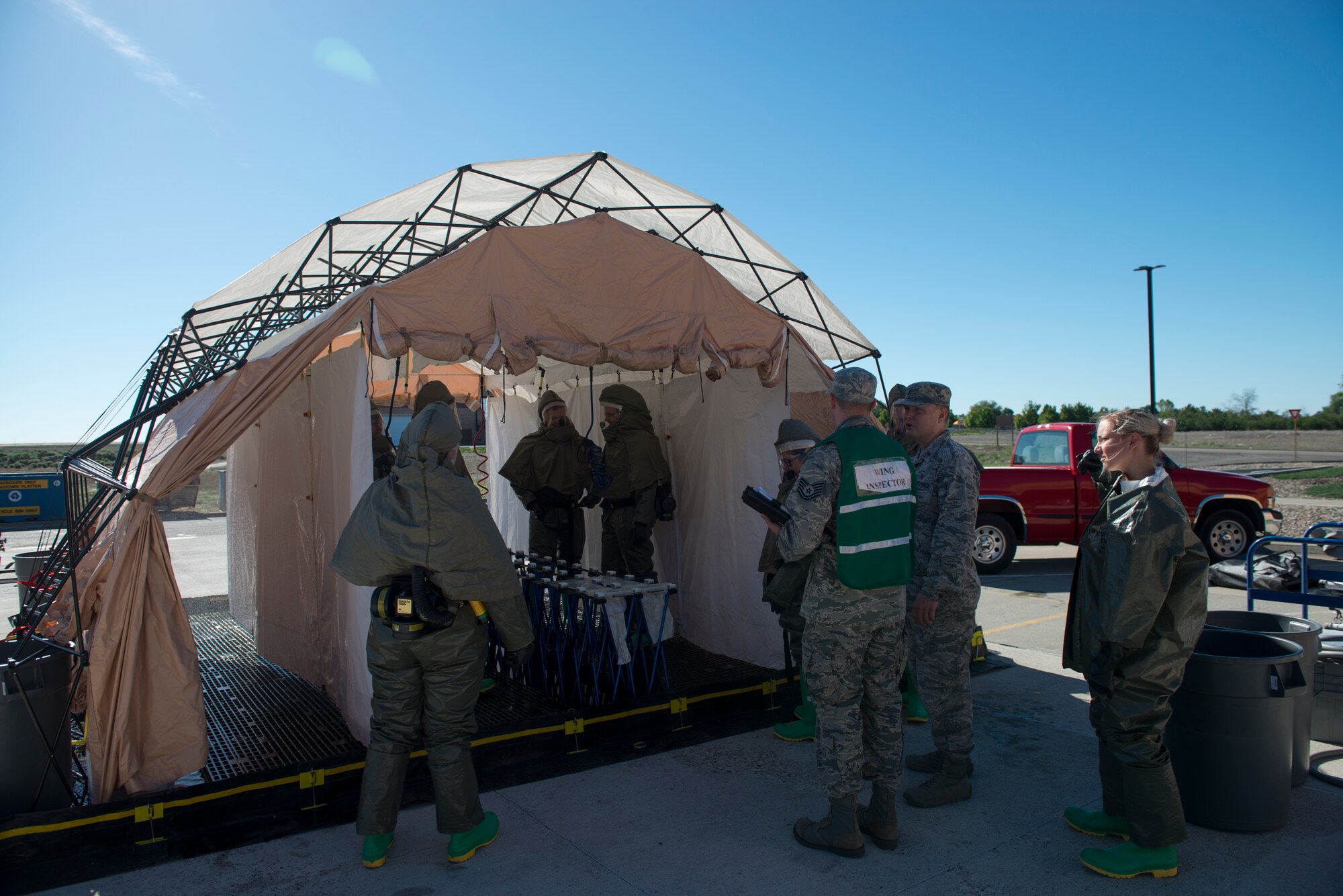 366th Medical Treatment Facility Airmen conduct a decontamination exercise, June 5, 2019, at Mountain Home Air Force Base, Idaho. The exercise gave Gunfighter children the opportunity out of their normal youth center routine to experience a job on base that very few people see. (U.S. Air Force photo by Airman 1st Class JaNae Capuno)