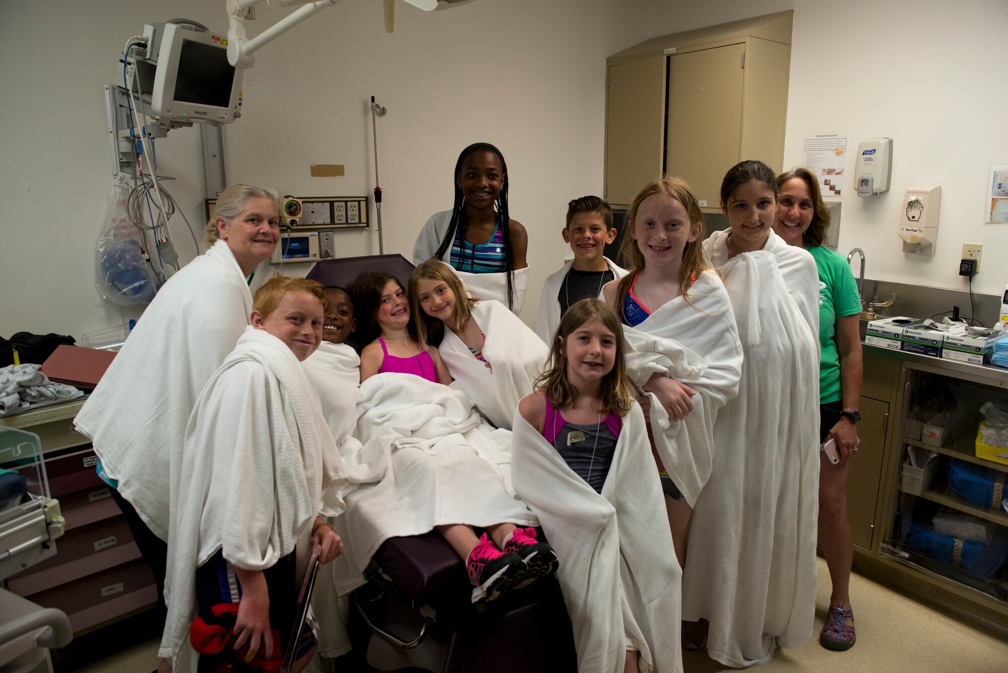 Gunfighter children participate in a 366th Medical Treatment Facility exercise, June 5, 2019, at Mountain Home Air Force Base, Idaho. The exercise gave Gunfighter children the opportunity out of their normal youth center routine to experience a job on base that very few people see. (U.S. Air Force photo by Airman 1st Class JaNae Capuno)