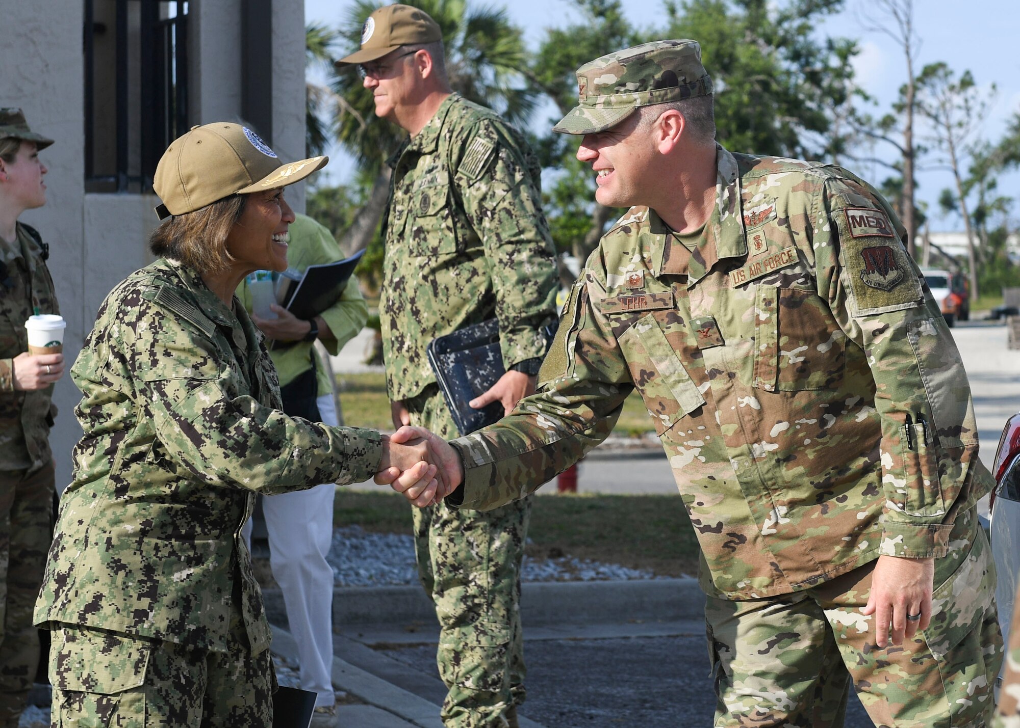 U.S. Navy Vice Adm. Raquel Bono, Defense Health Agency director, meets U.S. Air Force Col. Steven Lehr, 325th Medical Group commander, June 5, 2019 at Tyndall Air Force Base, Florida.