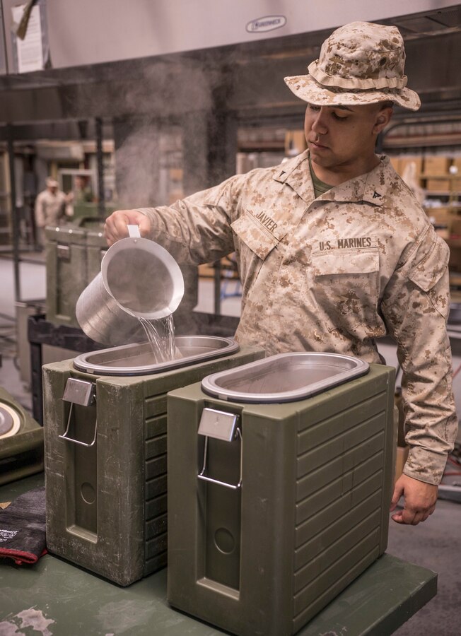 U.S. Marine Lance Cpl. David Javier, a food service specialist with 3rd Battalion, 25th Marine Regiment, 4th Marine Division prepares coffee for morning chow during Integrated Training Exercise 4-19 at Marine Corps Air Ground Combat Center Twentynine Palms, Calif., June 6, 2019. ITX measures the ability to provide a cohesive, trained and ready capability in support of service and Combatant Commander requirements. (U.S. Marine Corps photo by Cpl. Tessa D. Watts)