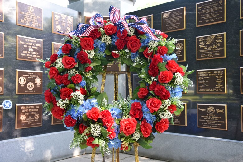 A wreath laying ceremony in Memorial Park at the National Museum of the U.S. Air Force, Wright-Patterson Air Force Base, is preceded by a flyover of a pair of C-47 transport aircraft. The ceremony kicks off the remembrance of the sacrifices made on June 6, 1944 in Normandy, France, site of the largest amphibious assault in history. (U.S. Air Force photo/Ken LaRock)