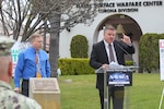 Naval Surface Warfare Center, Corona Division (NSWC Corona) Measurement Science and Engineering Department Head Richard Schumacher, right, and Measurement Science and Engineering Department Chief Engineer Robert Fritzsche, left, speak to members of the command during the World Metrology Day celebration.