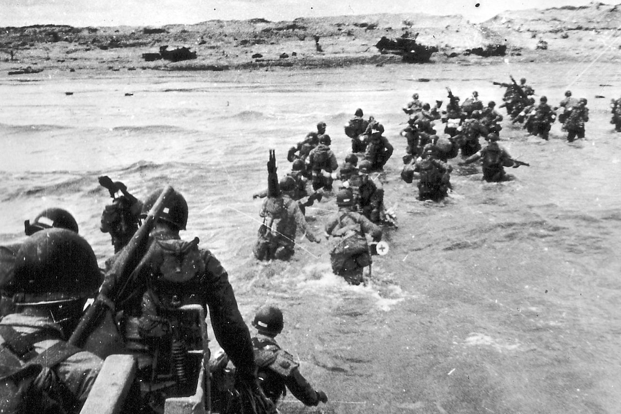 Troops wade ashore