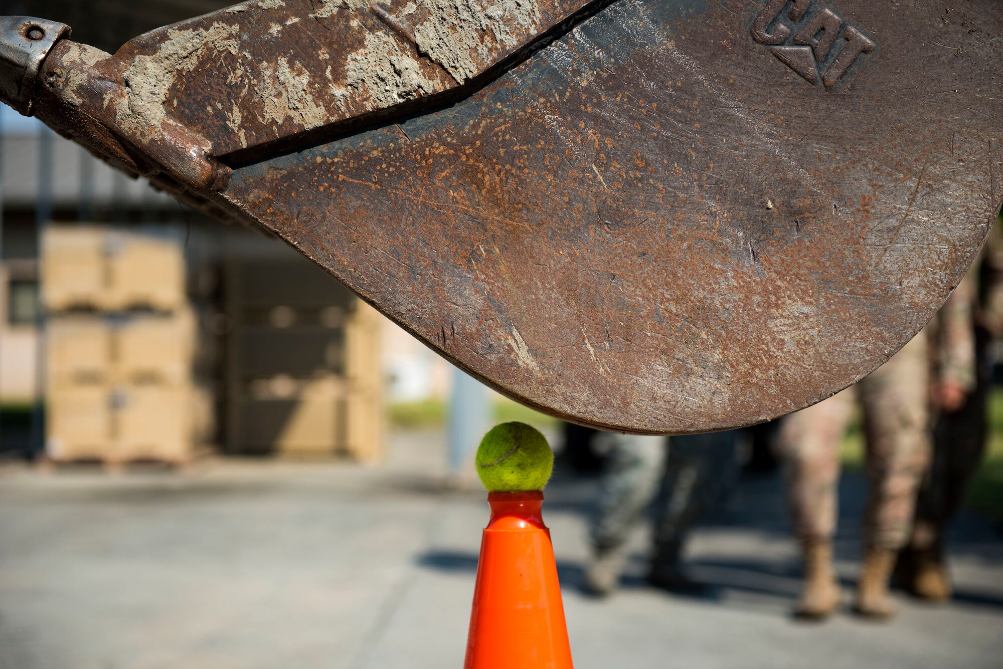 Col. Dee Jay Katzer, command engineer for Air Combat Command, attempts to grab a ball during a cone touch challenge during a squadron tour, May 22, 2019, at Moody Air Force Base, Ga. The challenge involved Katzer having to pick up a ball from the cone with a back hoe and then placing it back on the cone without it dropping. Katzer’s first visit to Moody consisted of a base tour, along with visiting various 23d Civil Engineer Squadron (CES) shops. He also observed Airmen from the 23d CES conduct airfield recovery training. (U.S. Air Force photo by Senior Airman Erick Requadt)