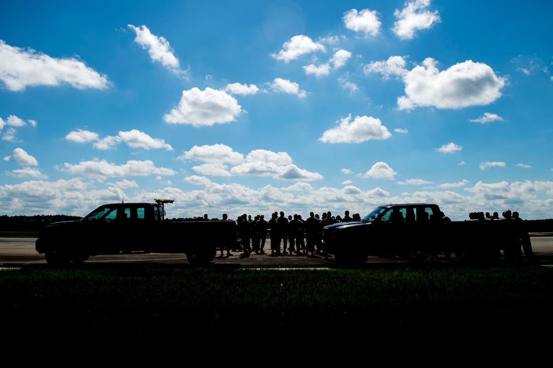 Airmen from the 23d Civil Engineer Squadron (CES) coordinate their actions during airfield recovery training, May 23, 2019, at Moody Air Force Base, Ga. The training consisted of Airmen responding to a simulated bombed airfield to perform the proper steps and procedures to ensure rapid airfield damage repair (RADR). Airfield damage assessment teams and RADR are two critical civil engineer capabilities that engineers must train on to maintain their readiness. CE Airmen can be sent to any Combatant Command area of responsibility and will join up with CE Airmen from other bases. (U.S. Air Force photo by Senior Airman Erick Requadt)