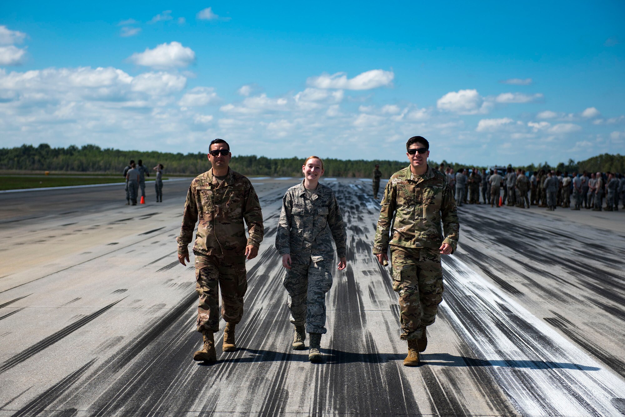 Senior Master Sgt. Victor Yañez, left, 23d Civil Engineer Squadron (CES) operations flight chief, 2d Lt. Kelsie Crouch, center, 23d CES project manager, and Senior Master Sgt. Robert Shuman, right, 23d CES exposal ordnance disposal flight chief, walk the flightline during airfield recovery training, May 23, 2019, at Moody Air Force Base, Ga. The training consisted of Airmen responding to a simulated bombed airfield to perform the proper steps and procedures to ensure rapid airfield damage repair in real-time. The training prepared the Airmen for potential threats that they could face while downrange. During the training, the engineers developed options to provide a minimum airfield operating strip which is based on the minimum length and width of runway needed to launch and recover the assigned or controlling aircraft for that location. “The Airmen have to understand their individual role and responsibilities, how this works in concert with other CE AFSCs, and why this is important to the Air Force mission,” said Lt. Col. Francis, 23d CES commander. “As long as the Air Force operates off airfields, Civil Engineers will need to learn and sharpen these skills.” (U.S. Air Force photo by Senior Airman Erick Requadt)