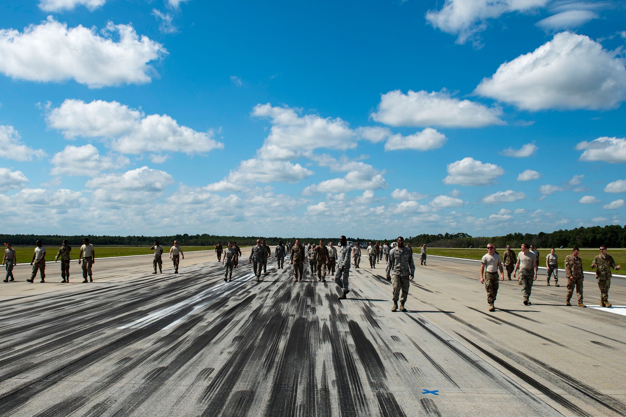 Airmen from the 23d Civil Engineer Squadron (CES) walk to simulated damaged areas during airfield recovery training, May 23, 2019, at Moody Air Force Base, Ga. The training consisted of Airmen responding to a simulated bombed airfield and perform the proper steps and procedures to ensure rapid airfield damage repair. The training prepared the Airmen for potential threats that they could face while downrange. “It is our goal that our Airmen will become more familiar with the tactics, techniques and procedures (TTPs) in the absence of resources,” said Chief Master Sgt. Caleb Vaden, 23d CES superintendent. “Our Airmen are very resourceful, and are able to drive great discussion about additional improvements to the current TTPs, that we will continue to consolidate and share with the Air Force Civil Engineer Center. Through this, we will continue to find ways to amplify our engineer’s readiness by whatever means we have.” (U.S. Air Force photo by Senior Airman Erick Requadt)