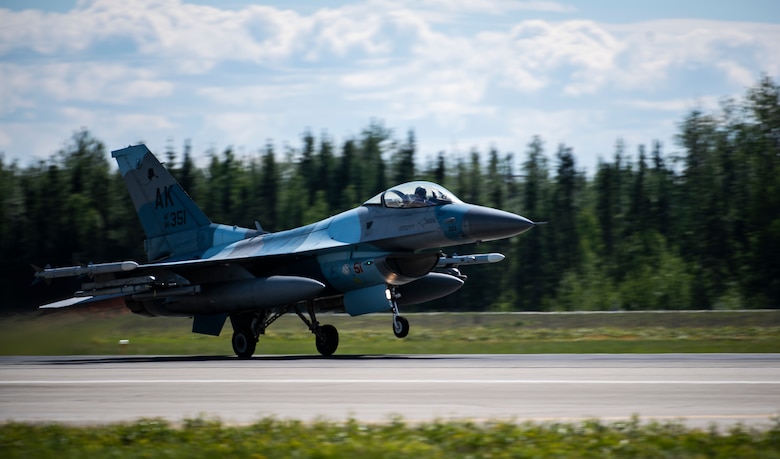 An F-16 Fighting Falcon from the 18th Aggressor Squadron takes off from Eielson Air Force Base, Alaska, June 5, 2019. The 18th AGRS mimics the paint schemes and flying techniques from foreign nations' air forces to create a realistic training opponent for pilots across the Air Force. (U.S. Air Force photo by Senior Airman Stefan Alvarez)