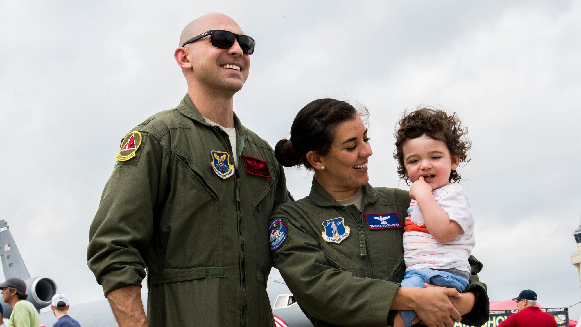 Maj. John R. Blankenship, a B-52 Stratofortress pilot with the 96th Bomb Squadron, his wife Maj. Natasha E. Blankenship, a C-17 Globemaster III pilot with the 183rd Airlift Squadron in Jackson, Mississippi, and their year and a half old son, Dane, enjoy the Barksdale Defenders of Liberty Air Show at Barksdale Air Force Base, La., May 18, 2019. Over 80,000 spectators  from the Ark-La-Tex region May 18 and 19, 2019 to witness a full weekend of military and civilian aircraft performances and displays. (U.S. Air Force photo by Airman Jacob B. Wrightsman)
