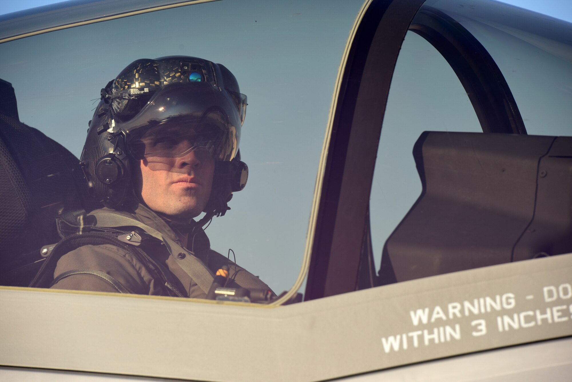An F-35A Lightning II pilot looks out his canopy during Astral Knight 2019 on June 3, 2019, at Aviano Air Base, Italy. The F-35A is designed to provide the pilot with unsurpassed situational awareness, positive target identification and precision strike in all weather conditions. (U.S. Air Force photo by Tech. Sgt. Jim Araos)