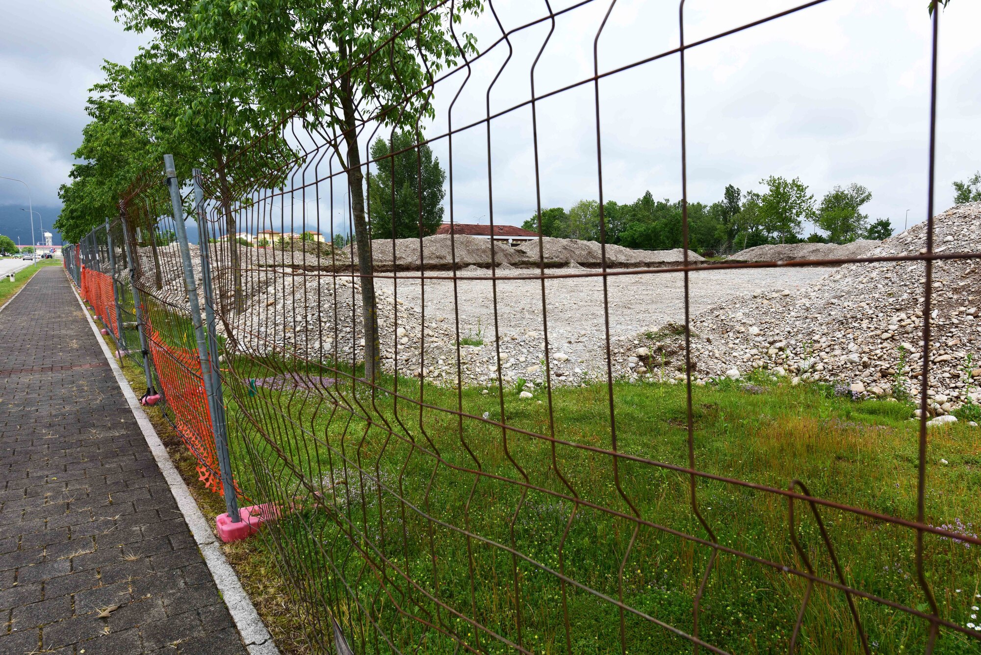 Clearing of the construction site has started on a new military working dog kennel scheduled to be built next to the veterinary clinic on Aviano Air Base, Italy. The new facility will be home to the 31st Security Forces Squadron military working dog unit as part of their move from Area E to Area F. (U.S. Air Force photo by Senior Airman Kevin Sommer Giron)