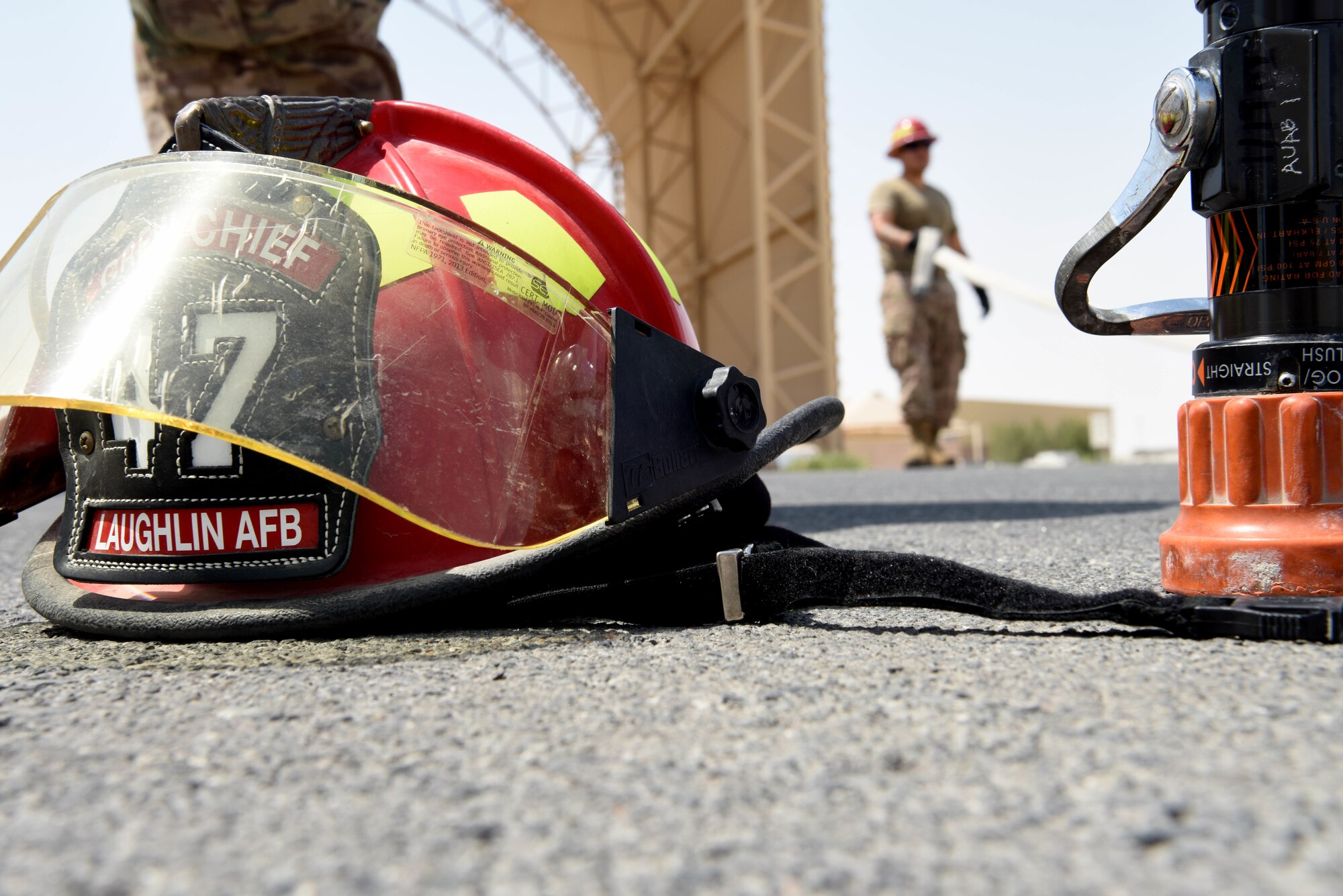 Gear is laid on the concrete while the 379th Expeditionary Civil Engineer Squadron Fire Station Airmen pack up on June 6, 2019, at Al Udeid Air Base, Qatar. The 379th ECES fire department provides fire and emergency services to protect lives and property from fires, (U.S. Air Force photo by Staff Sgt. Ashley L. Gardner)