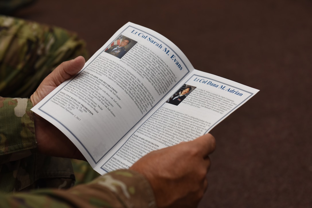 Col. Paul Quigley, 39th Weapons Systems Security Group commander, reads a program during a change of command ceremony June 7, 2019, at Incirlik Air Base, Turkey. The program includes the biographies from both the incoming and outgoing commanders, their duty history, awards and achievements. (U.S. Air Force photo by Staff Sgt. Matthew J. Wisher)